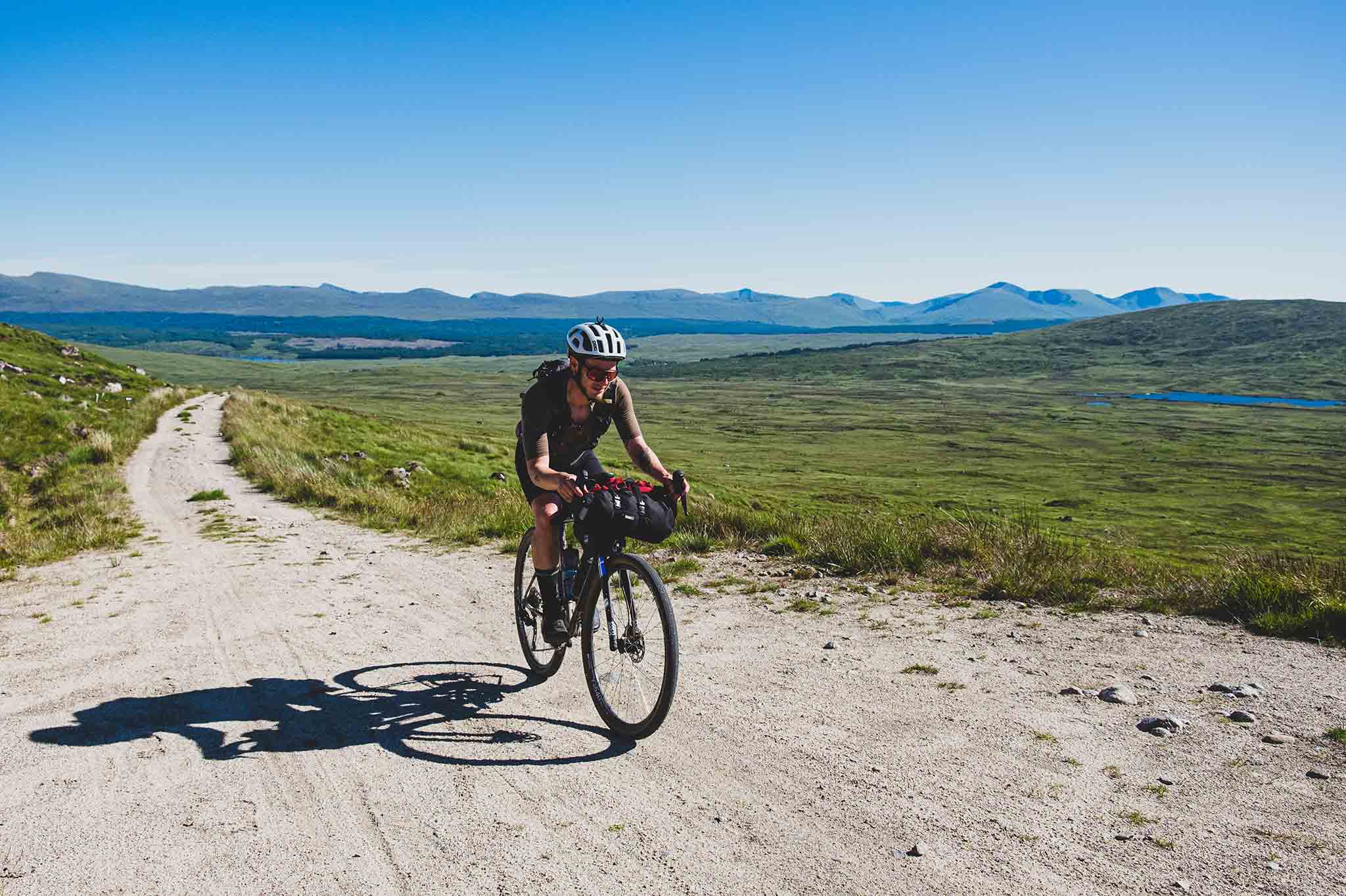 Marcus Nicolson is an adventure cyclist based in Glasgow, Scotland. He has just broken the Fastest Known Time for the Badger Divide, wearing QUOC's Gran Tourer Grave Cycling Shoe. 